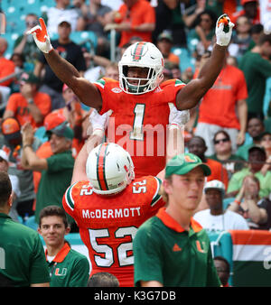 Miami running back Mark Walton (1) runs 44 yards for a touchdown ...