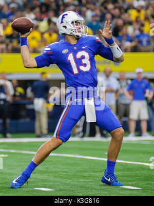 Florida quarterback Feleipe Franks (13) scrambles for yardage in front ...