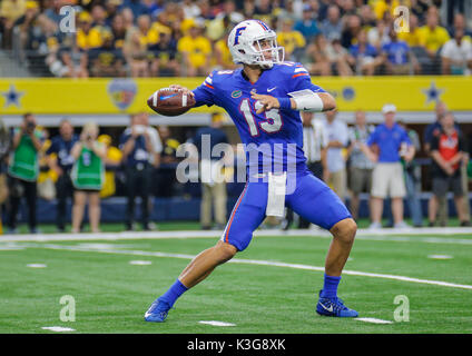 Florida quarterback Feleipe Franks (13) scrambles for yardage in front ...