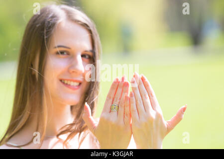Portrait of young beautiful woman with long hair Shows beautiful nails on hands Stock Photo