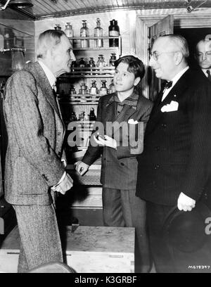 HENRY FORD [left] is on hand at the famous museum of relics and original laboratory of inventor Thomas Edison, at Dearborn, Michigan, to show round juvenile actor MICKEY ROONEY and Metro-Goldwyn-Mayer studio chief LOUIS B MAYER in connection with the world premiere at Port Huron of the M-G-M production YOUNG TOM EDISON the story of Thomas Alva Edison's boyhood, with Mickey Rooney in the title part. Stock Photo