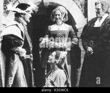 A MAN FOR ALL SEASONS MARK CHAMBERLAIN, ADRIENNE THOMAS, VANESSA REDGRAVE , CHARLTON HESTON as Sir Thomas More on location at Dourney Court A MAN FOR ALL SEASONS from left - MARK CHAMBERLAIN, ADRIENNE THOMAS, VANESSA REDGRAVE [behind], and CHARLTON HESTON as Sir Thomas More, on location at Dourney Court Made at Pinewood with US money [Turner Network Television] and directed by Charlton Heston, produced by his son Fraser Heston Stock Photo