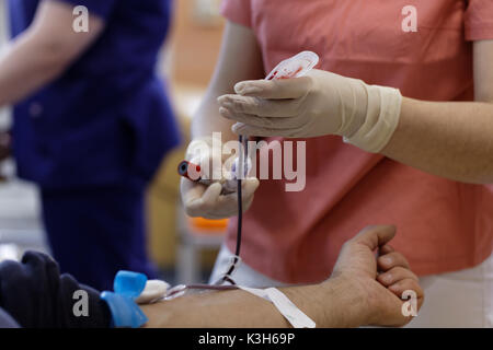 St. Petersburg, Russia - February 20, 2017: Potential blood donor pass the blood test from vein in the city blood transfusion station. This year the s Stock Photo