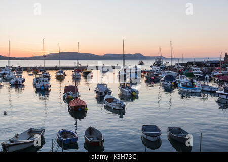 England, Dorset, Lyme Regis, The Harbour at Dawn Stock Photo