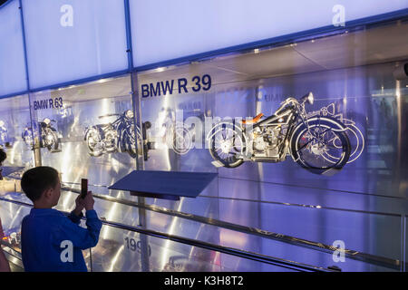 Germany, Bavaria, Munich, BMW Museum, Display of Vintage BMW Motorbikes Stock Photo