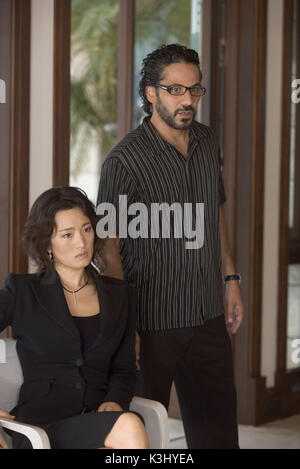 GONG LI as Chinese-Cuban financial criminal Isabella and JOHN ORTIZ as drug middleman Jose Yero in Miami Vice, the feature film crime drama that liberates what is adult, dangerous and alluring about working deeply undercover. MIAMI VICE GONG LI as Chinese-Cuban financial criminal Isabella and JOHN ORTIZ as drug middleman Jos&#x9819;ero GONG LI as Chinese-Cuban financial criminal Isabella and JOHN ORTIZ as drug middleman Jos&#x9819;ero in Miami Vice, the feature film crime drama that liberates what is adult, dangerous and alluring about working deeply undercover. Stock Photo