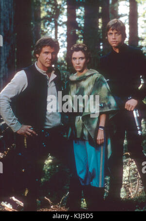 STAR WARS: EPISODE VI - RETURN OF THE JEDI HARRISON FORD as Han Solo, CARRIE FISHER as Princess Leia, MARK HAMILL as Luke Skywalker     Date: 1983 Stock Photo