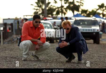 Simple Man Stars DAVID CARUSO and ADAM RODRIGUEZ. Licenced by Channel 5 Broacasting. Contact Five Stills: 0207 550 5583/5509/5544. Free for editorial press and listings use in connection with the current broadcast of Channel 5 programmes only. This. image may only be reproduced with the prior written consent of Channel 5. All rights reserved. Not for any form of advertising, internet use or in connection with the sale of any product. CSI MIAMI Series#1/Episode#17/Simple Man  Tx: 24/02/03 ADAM RODRIQUEZ as Eric Delko, DAVID CARUSO as Lt. Horatio Caine Stock Photo