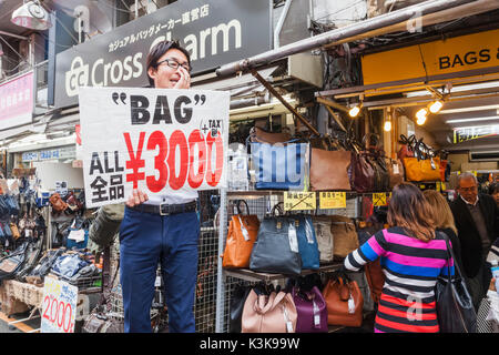 Japan, Hoshu, Tokyo, Ueno, Ameyoko Shopping Street, Bag Salesman Stock Photo