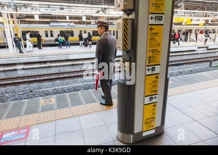 Japan, Hoshu, Tokyo, Shinjuku, Shinjuku Train Station Platform Scene Stock Photo