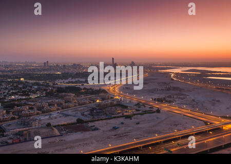 UAE, Dubai, Downtown Dubai, elevated desert and highway view towards Ras Al Khor, dawn UAE, Dubai, Downtown Dubai, elevated desert and highway view towards Ras Al Khor, dawn