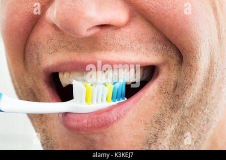 Close-up Of A Smiling Man With Toothbrush Stock Photo