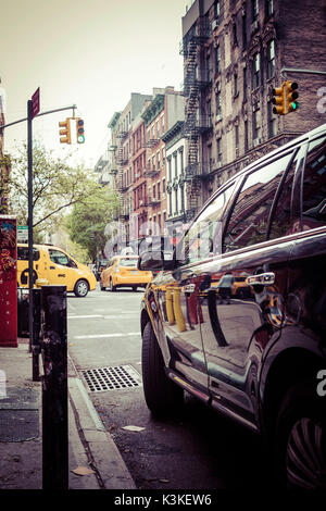 Yellow cabs and Streetview reflections in car varnish, Manhatten, New York, USA Stock Photo