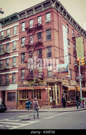 Streetview and a brick House with fire stairs, typical architecture in Little Italy, Manhatten, New York, USA Stock Photo