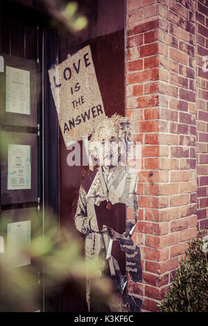 Einstein poster, Streetart, in a house entrance, 'Love is the answer', Chelsea, Art District, Manhatten, New York, USA Stock Photo