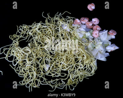 Shrimp Yakisoba Stir Fry made with grilled shrimp with stir-fry noodles and cabbage cooking on a grill Stock Photo