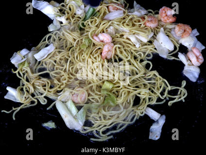 Shrimp Yakisoba Stir Fry made with grilled shrimp with stir-fry noodles and cabbage cooking on a grill Stock Photo