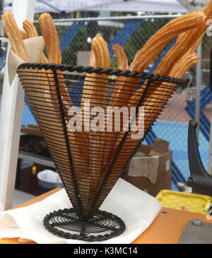 Churros in a metal basket Stock Photo