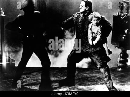 SON OF FRANKENSTEIN [US 1939] LIONEL ATWILL, BORIS KARLOFF as The Monster, DONNIE DUNAGAN [child actor]     Date: 1939 Stock Photo