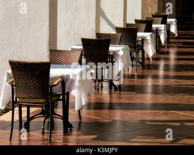 close up shot of outdoor empty restaurant table and chairs. Stock Photo