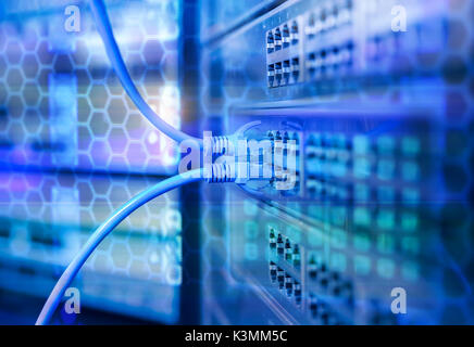 Network cables in switch and firewall in cloud computing data center server rack Stock Photo