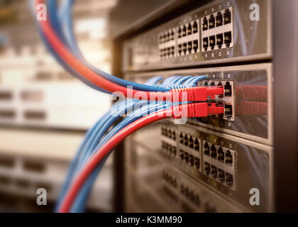 Network cables in switch and firewall in cloud computing data center server rack Stock Photo