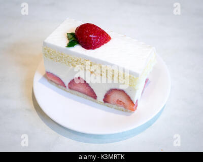 A slice of delicious strawberry shortcake, a popular dessert. Stock Photo