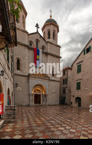 The church of St. Nikola (Sveti Nikola). On the external facade there is the flag of the Serbian Orthodox Church. Kotor, Montenegro Stock Photo