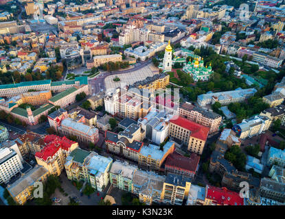 Aerial view of the Kiev, Ukraine. Top view from flying drone of a beautiful buildings, road, park at sunset. Cityscape. Aerial photo of a downtown in  Stock Photo