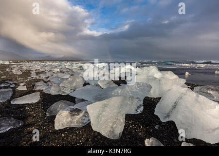 Ice blocks on the black sand beach in Jokulsarlon Glacier Lagoon, Eastern Iceland, Europe Stock Photo