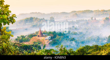 Mrauk-U, Rakhine state, Myanmar. Mrauk-U valley in a foggy sunrise seen from the Shwetaung pagoda. Stock Photo