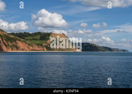 Red sandstone triassic cliffs looking from L) Salcombe mouth near Sidmouth along to R) Beer, Devon. Stock Photo