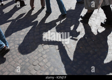 Urban scene of friendship,with shadows in circle,  Naples Stock Photo