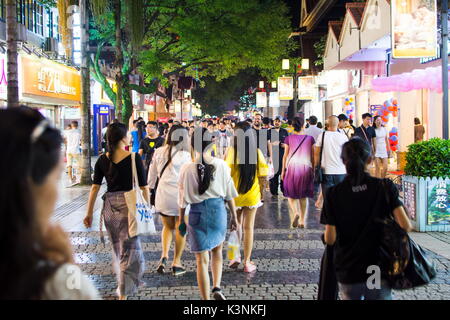 GUILIN, CHINA - JUNE 11, 2017: People in the Zhengyang, famous walking street, visited by many local and foreign tourists. Primarily meant for recreat Stock Photo