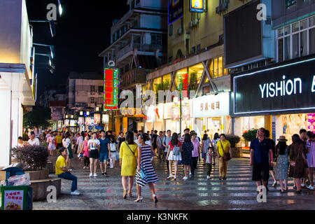 GUILIN, CHINA - JUNE 11, 2017: People in the Zhengyang, famous walking street, visited by many local and foreign tourists. Primarily meant for recreat Stock Photo