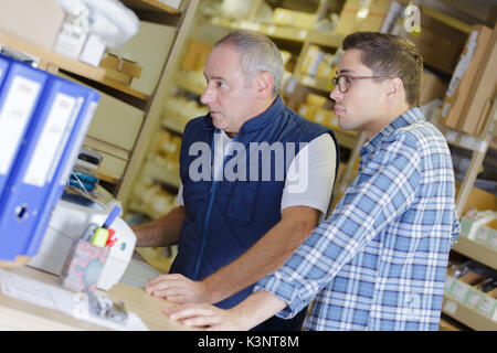 2 workers in a warehouse Stock Photo