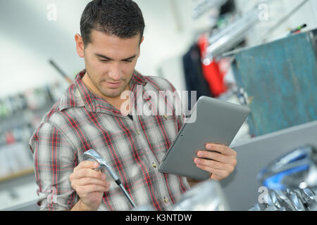 plumber with tablet buying supplies Stock Photo