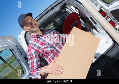 male movers unloading from truck Stock Photo