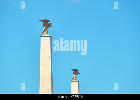 Vienna, Austria - September 24, 2014: Gilded eagles on columns at main entrance of the Schonbrunn palace Stock Photo