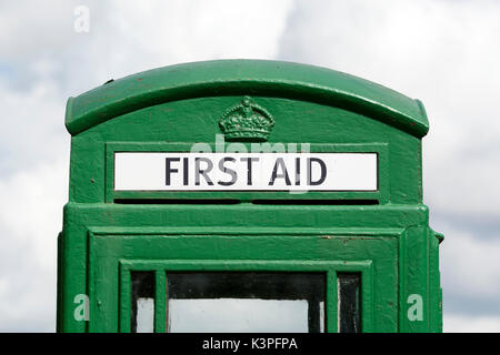 Green converted defibrillator and first aid telephone box, Berrow Green, Worcestershire, England, UK Stock Photo