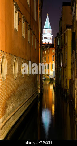 The bell tower in Saint Mark's square hiding through the channels in Venice Veneto Italy Europe Stock Photo