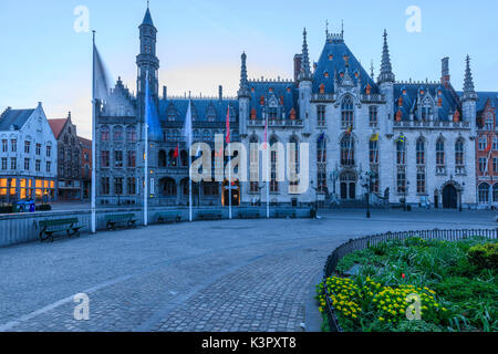 Blue lights of dusk on the gothic palace of the Provinciaal Hof in Market Square Bruges West Flanders Belgium Europe Stock Photo