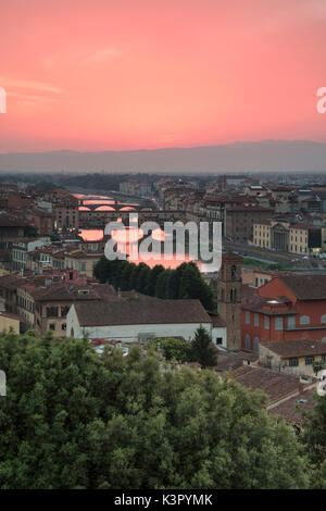 Pink sunset on the Arno River and Ponte Vecchio seen from Piazzale Michelangelo Florence Tuscany Italy Europe Stock Photo
