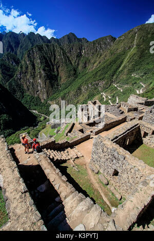 Picture of the so called 'Industrial Sector' (factory houses) of the Machu Picchu Inca ruins in Peru.  It is hypothesized that buildings that are located below the Main Plaza were used by workers to make weavings and pottery Peru South America Stock Photo