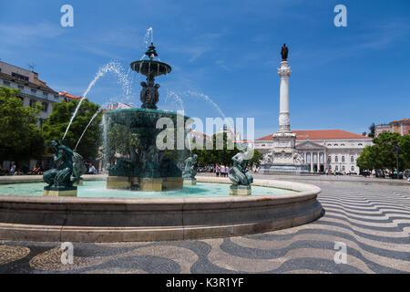 Fountain frames the old palace in Praça Dom Pedro IV also known as Rossio Square Pombaline Downtown of Lisbon Portugal Europe Stock Photo