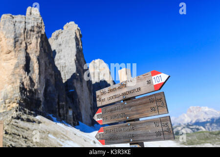Signs indicate the paths for walkers. Sesto Dolomites Trentino Alto Adige Italy Europe Stock Photo