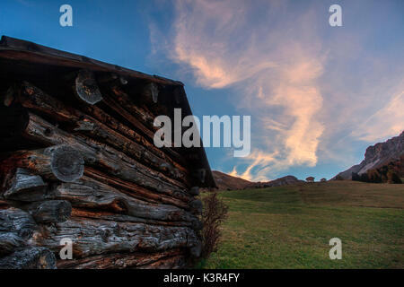 Sunrise at malga Gampen, in the background the Odle group, Trentino Alto Adige, Italy Stock Photo