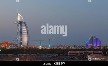 Dubai, United Arab Emirates. A night shot of Dubai's most well known landmarks : The Burj Al Arab and Jumeraih Beach Hotel. Stock Photo