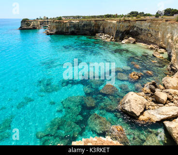 Picturesque seascape with cliffs and stacks (faraglioni), at Torre Sant Andrea, Salento sea coast, Puglia, Italy Stock Photo