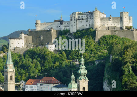 Hohensalzburg Castle in Austria, view from Moenchsberg. High Salzburg Fortress sits atop the Festungsberg. Small hill in Austrian city of Salzburg. Stock Photo